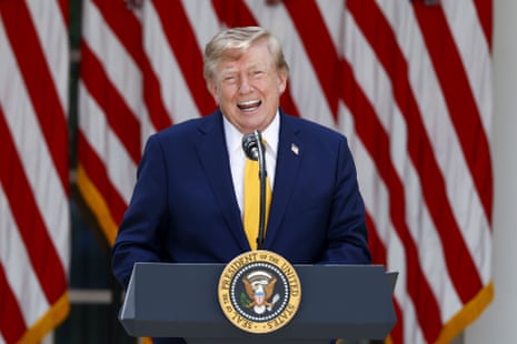 US president Donald Trump gives a speech on stage.