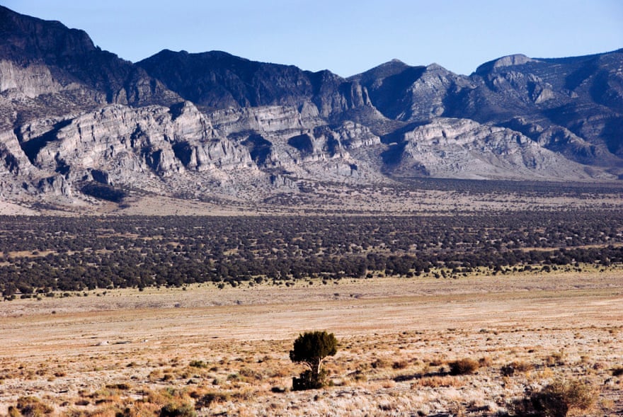 A dry plain with mountains in the background.