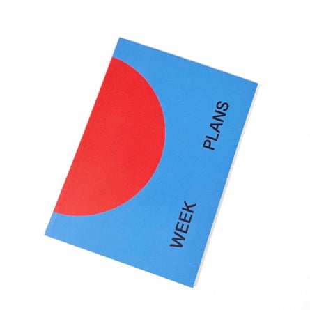 Blue book with a decorative red semi circle from the spine and the words ‘week’ and ‘plans’ printed near the open edge.