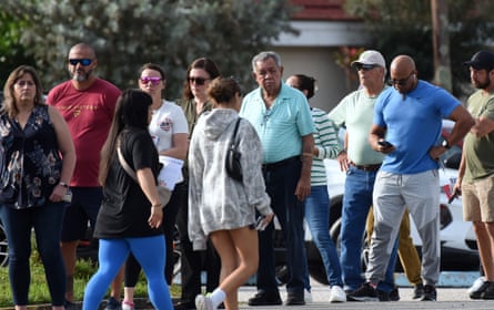 crowd of people waiting to vote