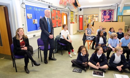 Katharine Viner, left, and Russell Scott, standing, on a visit to Russell Scott primary school