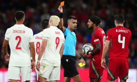 Referee Rohit Saggi shows a red card to Baris Alper Yilmaz
