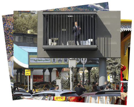 Passersby take pictures of an Iranian actor depicting Donald Trump in a mock prison cell attached to a billboard in Tajrish Square, Tehran.