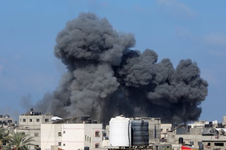 Smoke rises following an Israeli strike, in Deir Al-Balah.