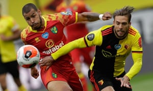 Norwich City’s Onel Hernandez (left) tussles with Watford’s Kiko Femenia.