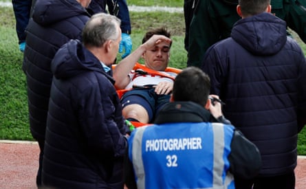 Tottenham’s Harry Winks is taken off on stretcher.