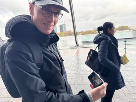 Dutch voter Henri de Haan showing his selfie with D66 leader Rob Jetten on the day of the Dutch general election.