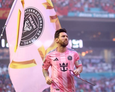 Messi on the pitch in his pink football shirt