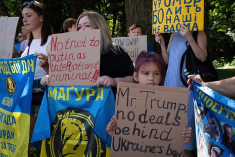 Women and children holding placards