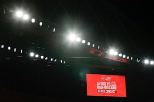The screen at the Emirates Stadium warns fans not to high five during the match against Burnley on 13 December.