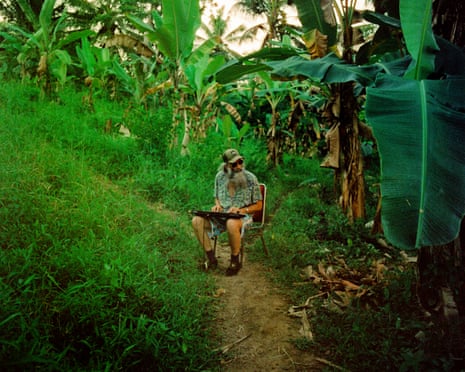 Ellis sits playing a keyboard in one of the enclosures