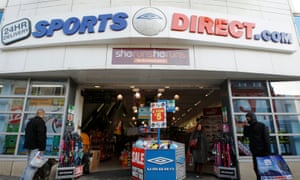 Shoppers wait outside a branch of Sports Direct
