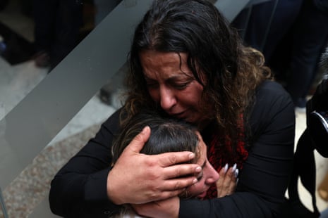 Women weep after their relative, who was expected to be released, did not arrive with freed Palestinian prisoners in the West Bank city of Ramallah.