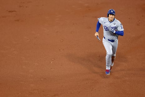 Shohei Ohtani runs the bases during the first inning.