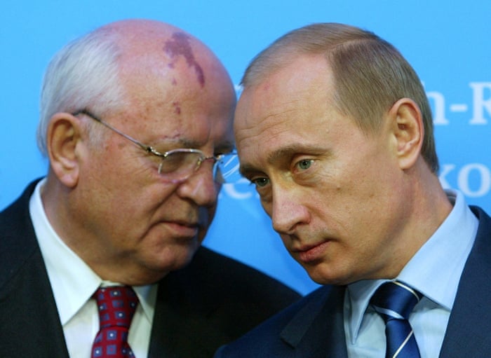 Russian President Vladimir Putin listens to former President of the Soviet Union Mikhail Gorbachev during a news conference following bilateral talks with German Chancellor Gerhard Schroeder in Germany, 2004.