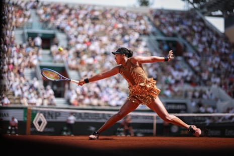 Osaka stretches for a backhand return to Jovic