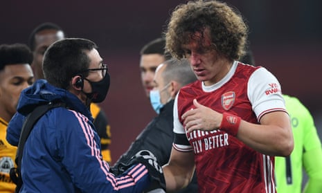 Arsenal’s David Luiz is treated after Sunday’s sickening clash of heads with Wolves’ Raúl Jiménez