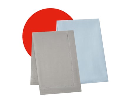 Two folded table cloths, one grey and one blue.
