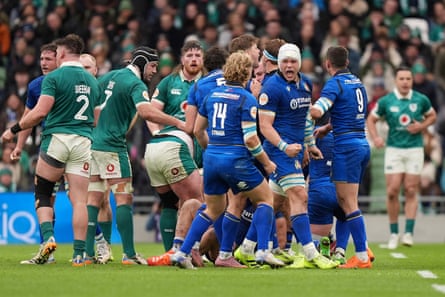 Italy players celebrate a successful scrum against Ireland.