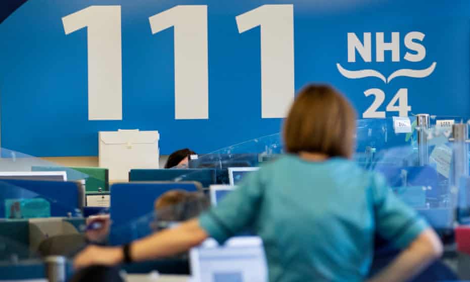 NHS staff deliver public information at an NHS 24 contact centre in Glasgow, Scotland.