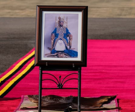 A portrait of the late king on the red carpet at Entebbe International airport.