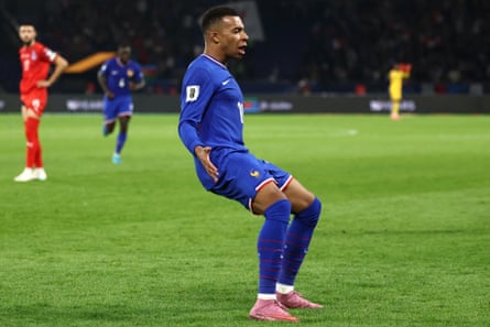 Kylian Mbappé celebrates opening the scoring for France against Azerbaijan.