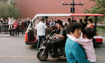 Beijing street scene with people and motor rickshaw