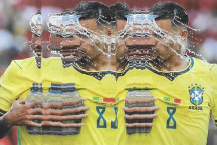Bruno Guimarães pours water on to his face. Original photograph by Adam Hunger.