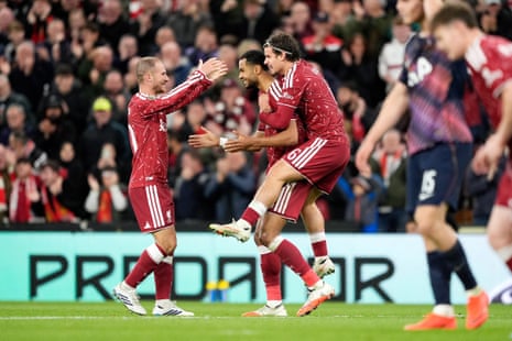 Cody Gakpo (centre) celebrates with teammates after scoring Liverpool's second goal.