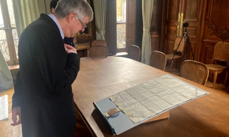 Mark Drakeford examining the Pennal letter, sent by Owain Glyndŵr to Charles VI, in Paris.