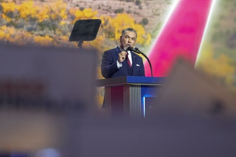 Greg Cunningham gestures while speaking at a podium during a political convention