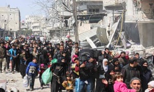 Civilians evacuate from the town of Jisreen in Eastern Ghouta.