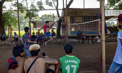 Burmese migrant workers play volleyball on their day off from work in Mae Sot