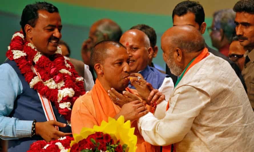Yogi Adityanath is offered sweets after he was elected as Chief Minister of India’s most populous state of Uttar Pradesh