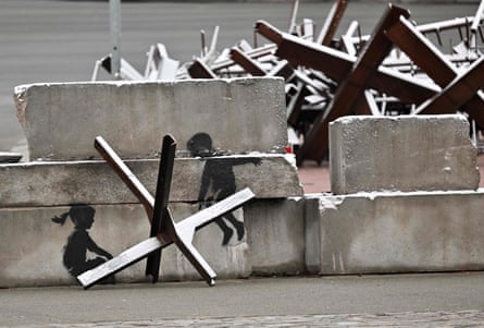 Banksy art painted next to tank traps in Kiev's Independence Square.