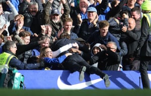Manager Antonio Conte can’t contain his excitement and jumps into the crowd to celebrate their win.