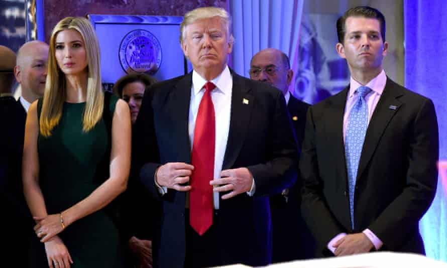 Donald Trump stands with his children Ivanka and Donald Jr on January 11 2017.