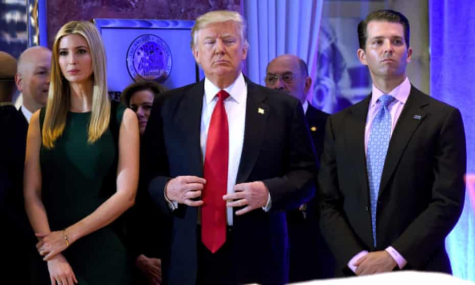 Donald Trump stands with Ivanka and Donald Jr in New York in 2017.