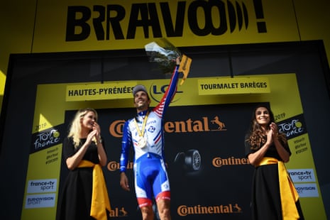 Thibaut Pinot looks as pleased as punch on the podium.