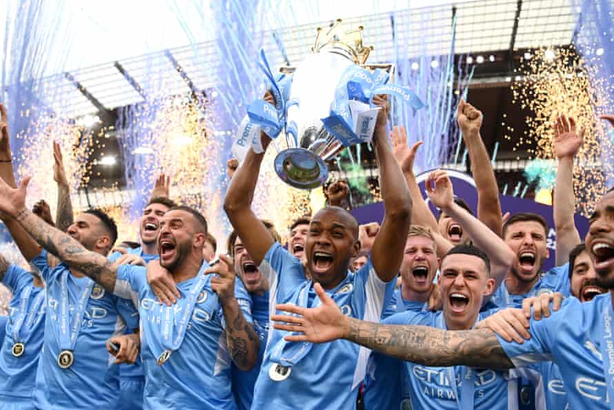 Fernandinho of Manchester City lifts the Premier League trophy.