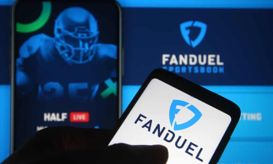 The FanDuel logo of a sports betting company is seen on a smartphone.