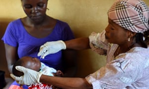 A baby receives a vaccine in Freetown, Sierra Leone, November 2014. The trial found that a ‘ring vaccination’ programme was effective in controlling Ebola.