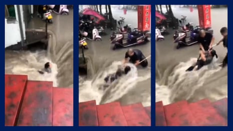 China: woman rescued from dangerous flood waters in Zhengzhou – video