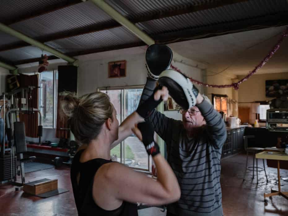 Peter Hill trains a newcomer to his gym in Fryerstown, Victoria.