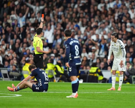Álvaro Carreras is shown a red card by referee Alejandro Quintero, taking Real Madrid down to nine men