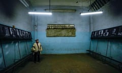 Former detainee Hector Hipolito Alvarez, poses for a photo inside of the dressing room of the National Stadium, which was used as a prison and place of torture, and where he was detained on Sept. 20, 1973, in Santiago, Chile, Saturday, Aug. 19, 2023. Alvarez was at the stadium for a presentation in honor of Chilean singer-songwriter Victor Jara who was murdered during the coup of Gen. Augusto Pinochet. (AP Photo/Esteban Felix)