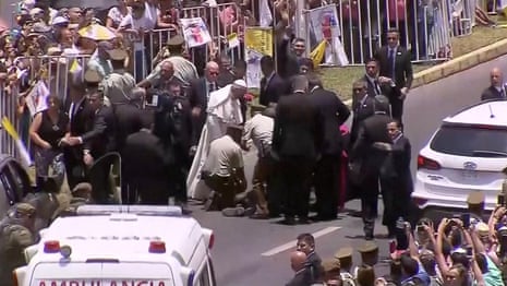 Pope Francis stops popemobile to comfort Chilean policewoman who fell from horse – video
