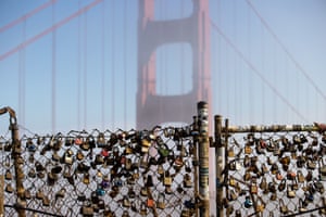 Sausalito, US: love locks adorn the Golden Gate view point as fog blankets the bridge in Marin Headlands by San Francisco
