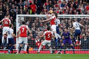Vertonghen catches the ball with his raised hand.