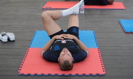 Harry Kane does stretching exercises at the England training base in Repino.